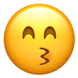 Apple design of the kissing face with smiling eyes emoji verson:ios 16.4