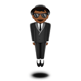Apple design of the person in suit levitating: medium-dark skin tone emoji verson:ios 16.4