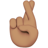 Apple design of the crossed fingers: medium skin tone emoji verson:ios 16.4