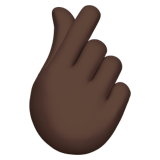 Apple design of the hand with index finger and thumb crossed: dark skin tone emoji verson:ios 16.4