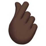 Apple design of the hand with index finger and thumb crossed: dark skin tone emoji verson:ios 16.4