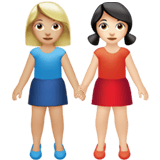 Apple design of the women holding hands: medium-light skin tone light skin tone emoji verson:ios 16.4