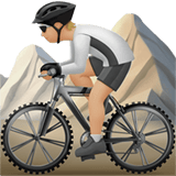 Apple design of the person mountain biking: medium-light skin tone emoji verson:ios 16.4