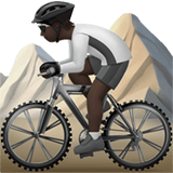Apple design of the person mountain biking: dark skin tone emoji verson:ios 16.4
