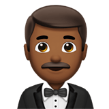 Apple design of the man in tuxedo: medium-dark skin tone emoji verson:ios 16.4