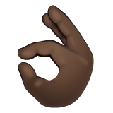 Whatsapp design of the OK hand: dark skin tone emoji verson:2.23.2.72