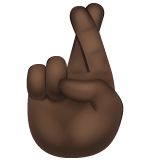 Whatsapp design of the crossed fingers: dark skin tone emoji verson:2.23.2.72