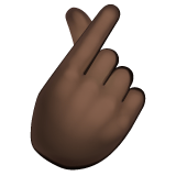 Whatsapp design of the hand with index finger and thumb crossed: dark skin tone emoji verson:2.23.2.72