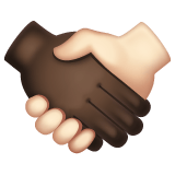 Whatsapp design of the handshake: dark skin tone light skin tone emoji verson:2.23.2.72