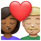 Whatsapp design of the kiss: woman man medium-dark skin tone medium-light skin tone emoji verson:2.23.2.72