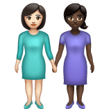 Whatsapp design of the women holding hands: light skin tone dark skin tone emoji verson:2.23.2.72