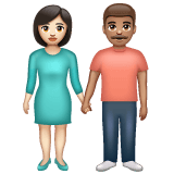 Whatsapp design of the woman and man holding hands: light skin tone medium skin tone emoji verson:2.23.2.72