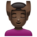 Whatsapp design of the man getting massage: dark skin tone emoji verson:2.23.2.72